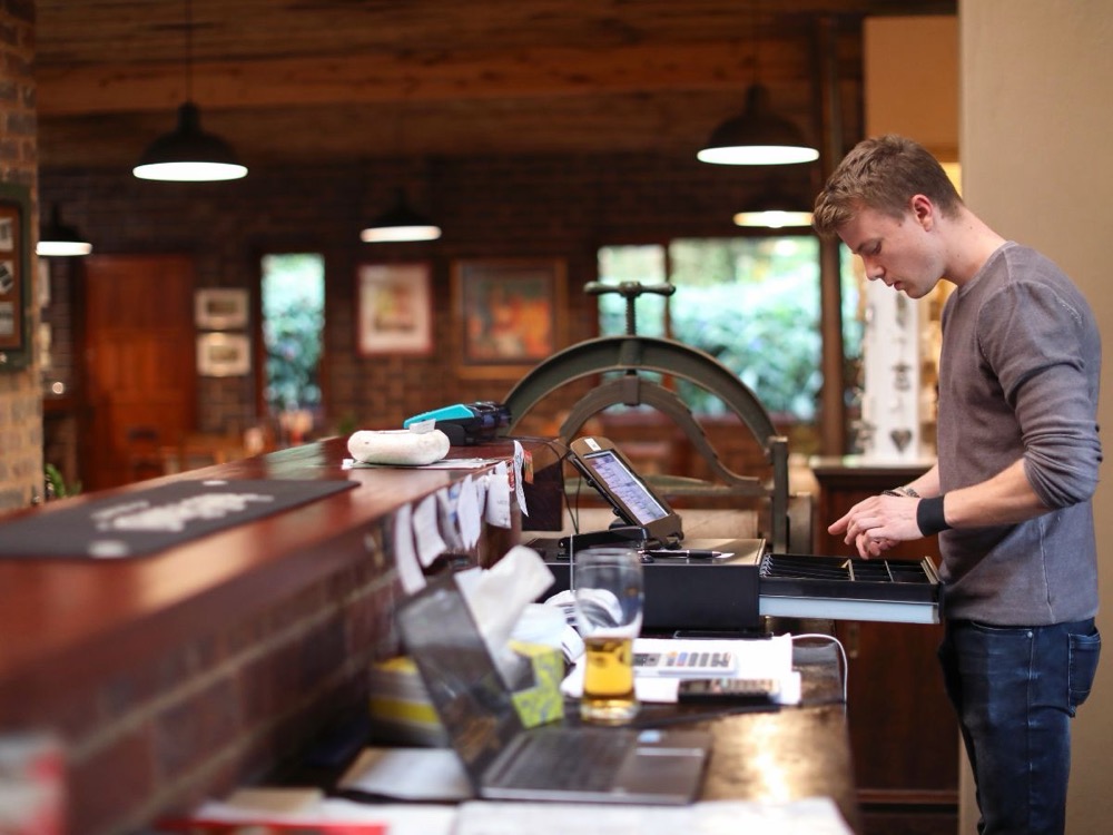 Point-of-sale register at a bar counter