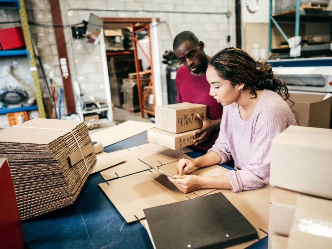 Online business owners packing customer orders